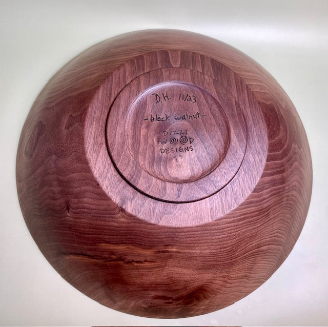 Black walnut bowl with 100% food safe oil-based finish and buffed to a matte sheen.