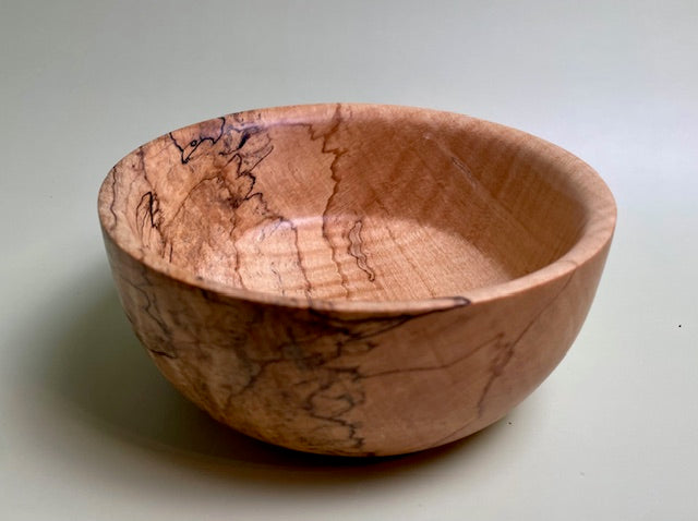 Maple bowl with 100% food safe oil-based finish and buffed to a matte sheen.