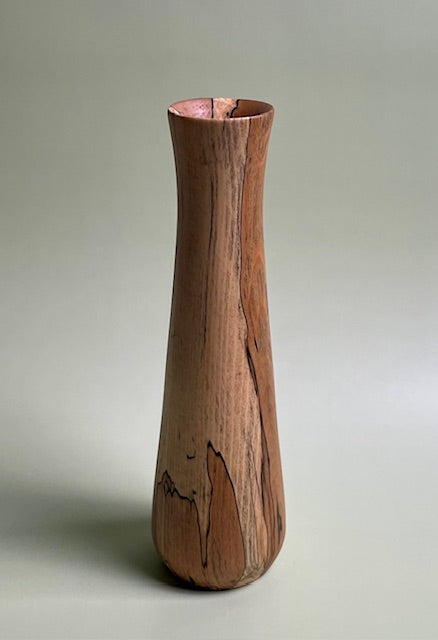 Transform your space with the bold and daring spalted Beech wood vase.