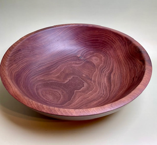 Black walnut bowl with 100% food safe oil-based finish and buffed to a matte sheen.