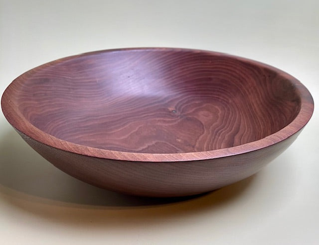 Black walnut bowl with 100% food safe oil-based finish and buffed to a matte sheen.