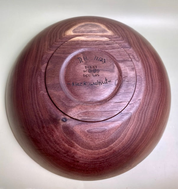 Black walnut bowl with 100% food safe oil-based finish and buffed to a matte sheen.