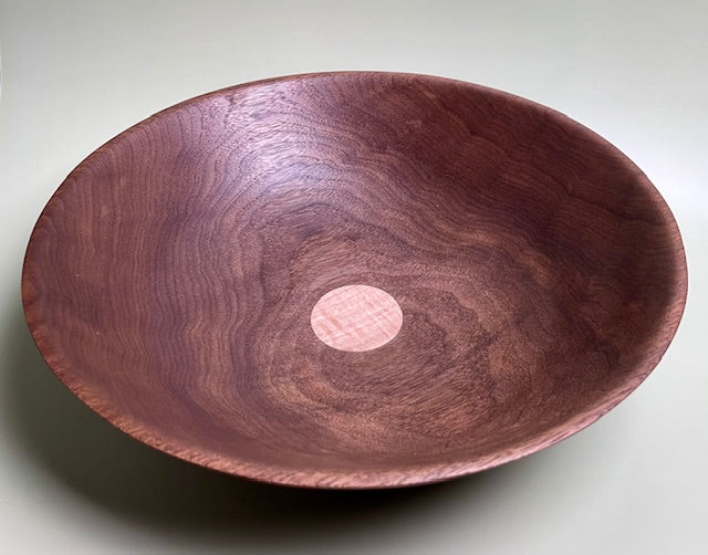 Black walnut bowl with 100% food safe oil-based finish and buffed to a matte sheen.