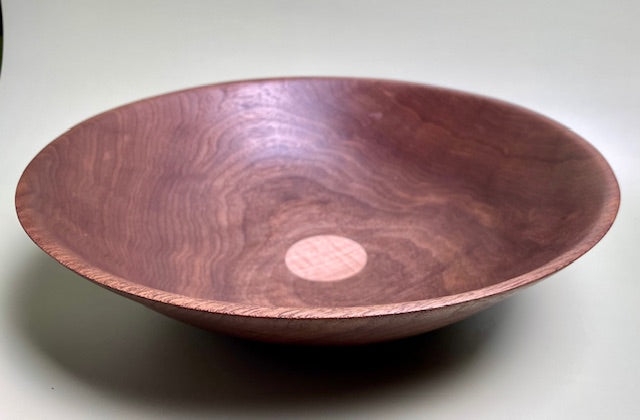 Black walnut bowl with 100% food safe oil-based finish and buffed to a matte sheen.